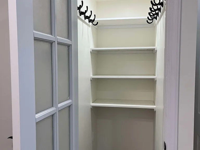 Pantry / Coat Closet (Charging station for robot vacuum)