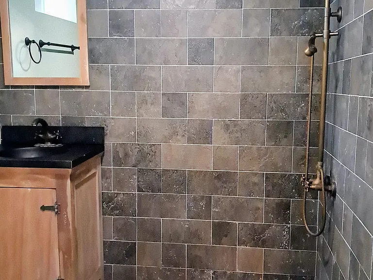 Bathroom has rainfall showerhead.