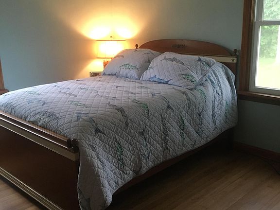 Back bedroom with both double bed and twin bed.