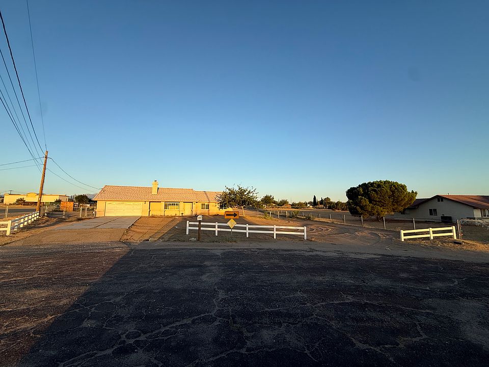 Front yard has multiple date palms, a mulberry shade tree, and a Chinese pistachio shade tree for driveway shade. Plenty of parking!