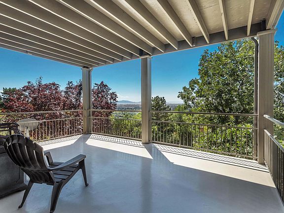Private deck with gas fireplace and sunset views of antelope island and salt lake