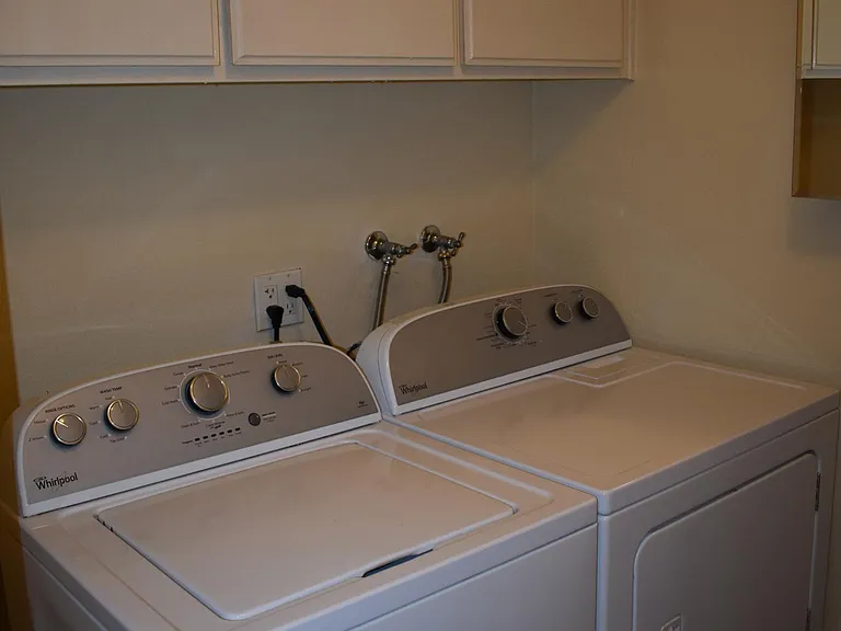 Laundry room including washer and dryer.