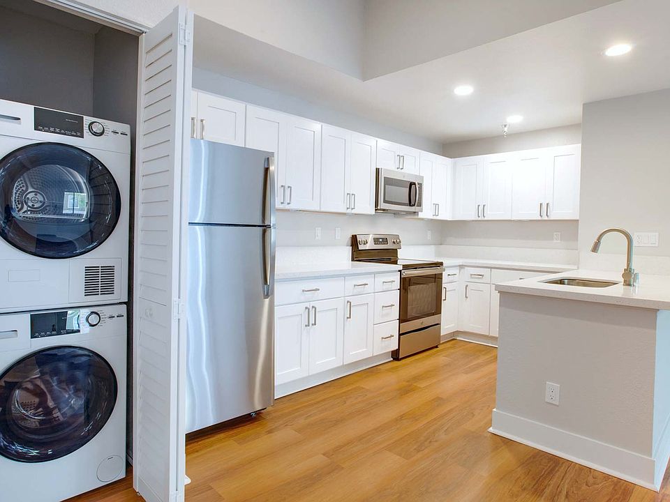 Renovated kitchens with stackable laundry in-unit.