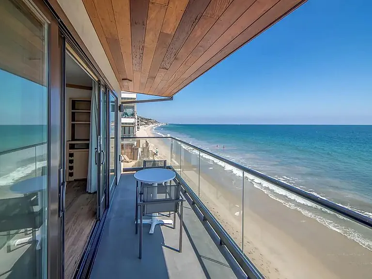 Enjoy your morning coffee with sunlight and fresh ocean air.