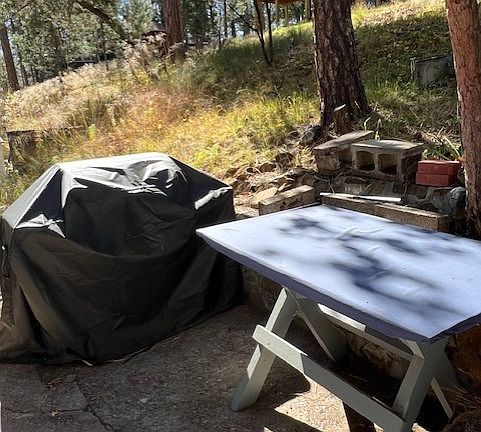 Grill and table on front porch