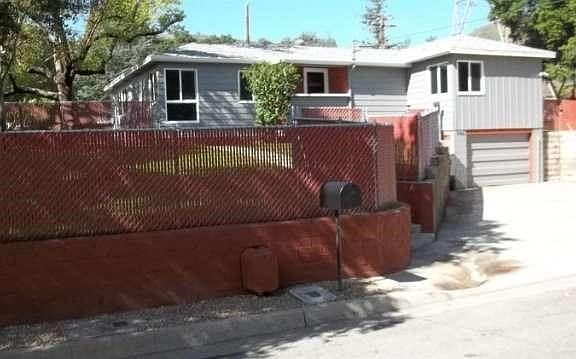 Potential for small R.V. in front...just wait until you see what awaits inside and in the back yard!