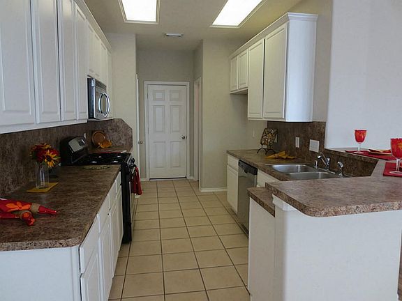 Large open kitchen with new stainless appliances.Gas Stove.