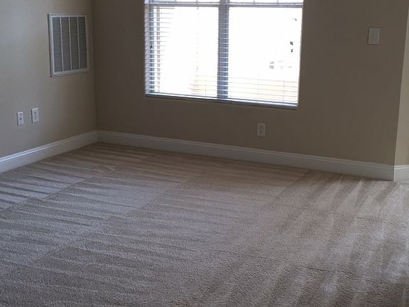 Living room with window leading out to back porch