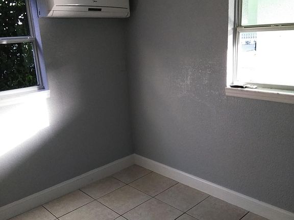 Living Room. Blinds (not pictured here) are included.