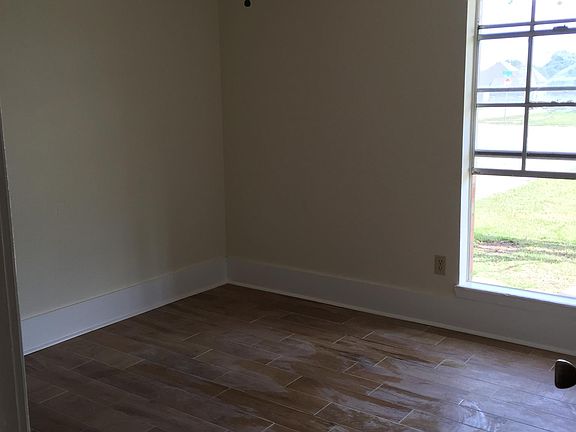 Large bedrooms with ceiling fans and new Windows