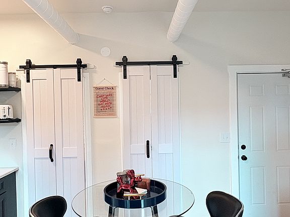 Cafe-style dining area with modern chairs