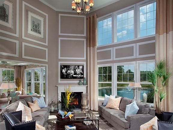 Dramatic 2 Story Great Room with plenty of windows and cozy gas fireplace