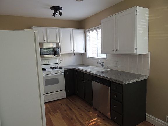 Kitchen with updated counters and gas stove