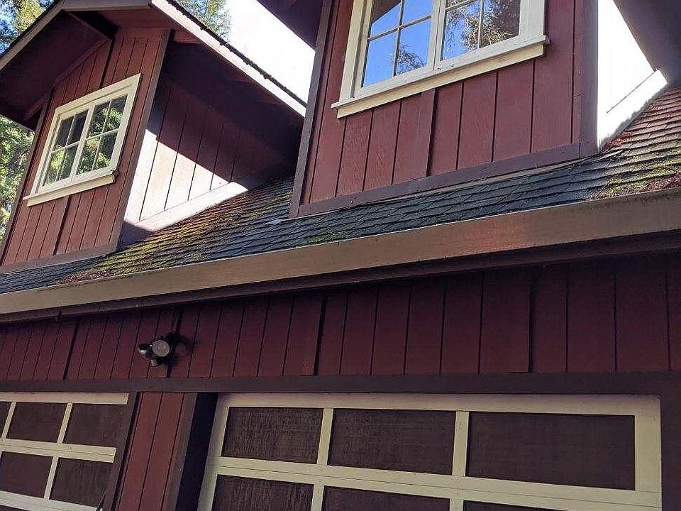 View looking up at kitchen window (Right) & bathroom window (left)