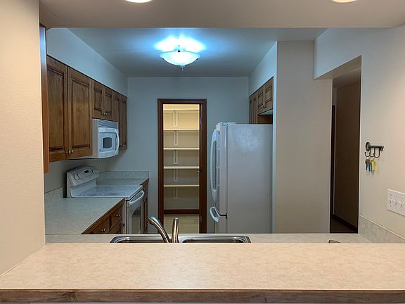 View of kitchen, pantry/storage in rear