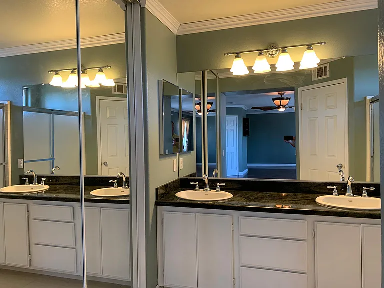 Very large master bedroom with double sinks.
