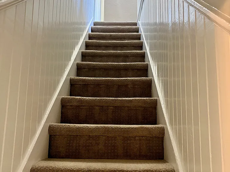 Stairway to two bedrooms and addition play-space or open office area