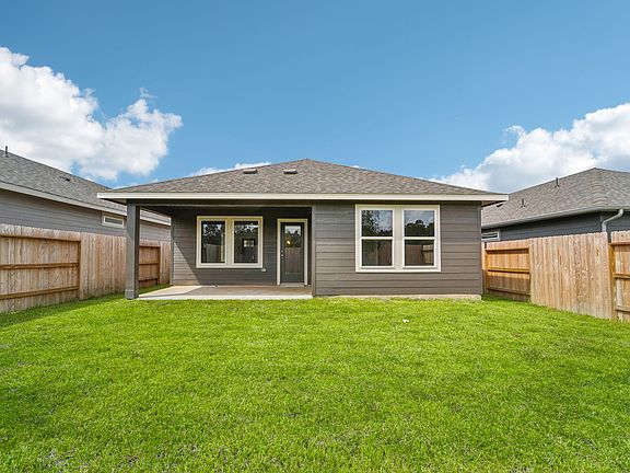 The backyard in a home in Pine Lake Cove of Montgomery, TX.