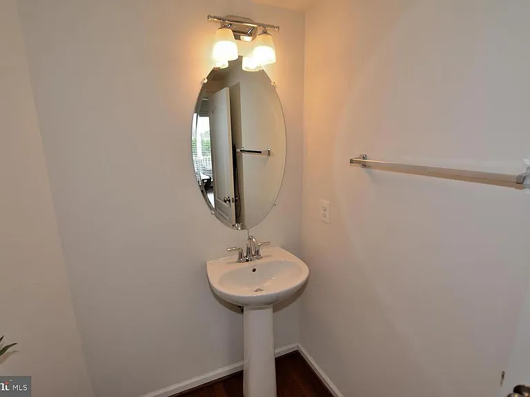 Bathroom 4 , powder room next to living area