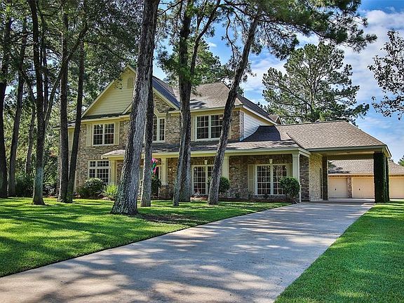 The portico adds elegance to the front elevation and conveniennt entry to the utility room during those rainy days. Over-sized three car garage!