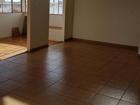 Upstairs living room/enclosed patio