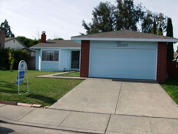 View of front with garage door.
