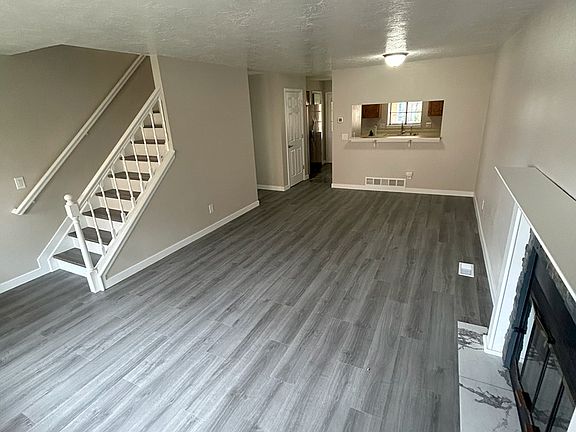 Main Floor living room 12' x 21' with real wood burning fireplace