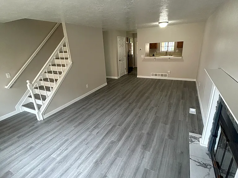 Main Floor living room 12' x 21' with real wood burning fireplace