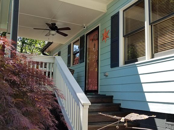 Covered front porch with a fan to keep you cool.