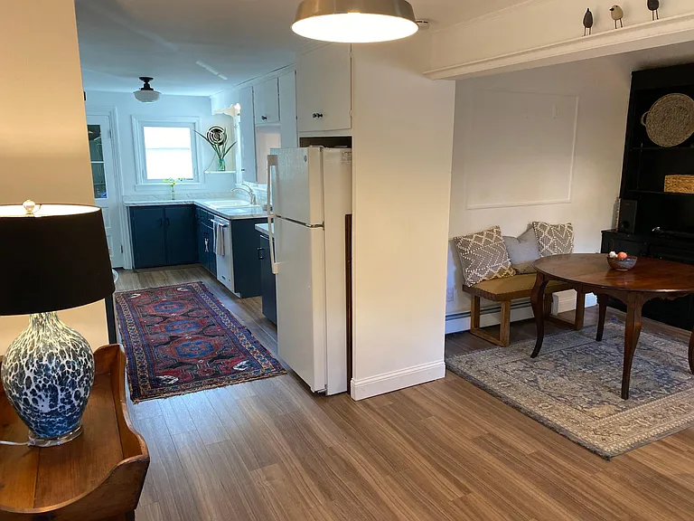 Family space w built-in cabinets to right