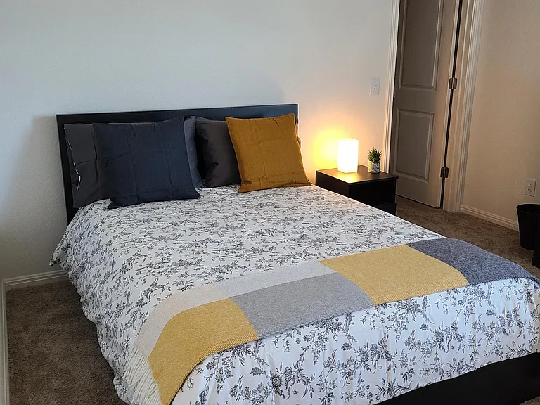 Bedroom #4 located in the second floor. Furniture includes a full size (double bed), night table and lamp, 4-drawer dresser, full size mirror and a work area (desk, lamp, USB-power strip and chair)