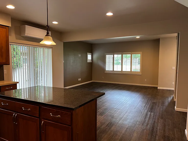 Open concept kitchen, dining and living with 9 ft ceilings, recessed lighting and luxury plank flooring throughout main floor.