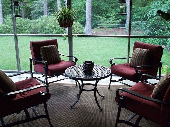Porch overlooking beautifully landscaped and private backyard