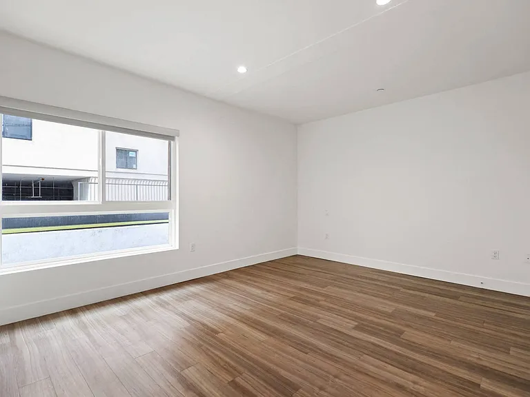 Bedroom with Recessed Lighting, Vinyl Flooring, and Large-Size Windows