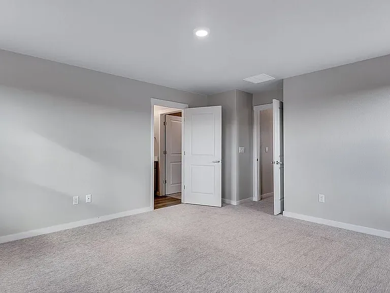 Primary/Master Bedroom looking at Hallway and into Bathroom