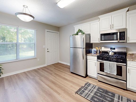 Revel in the incredible Jekyll kitchen that harmonizes functionality and style with a gorgeous picture window and full-size appliances.