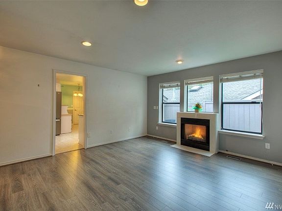 Newer flooring in living room and hallway.