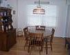 dining room w/hardwood floors and view of private backyard