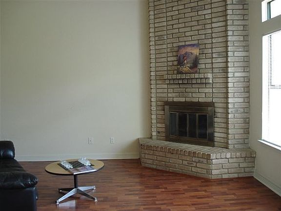 Then we'll relax in the large high ceiling living room next to the fireplace.