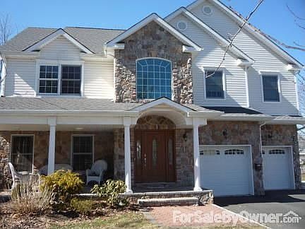 Front
						:
						Covered porch, stone front