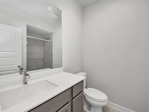 Downstairs Bathroom: Conveniently located full bathroom on the main floor.