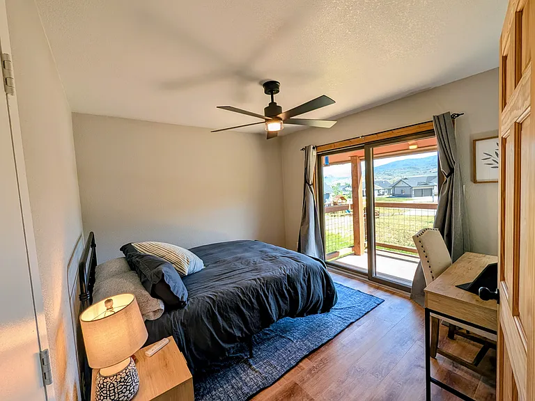 Guest Bedroom with computer desk and walk out deck