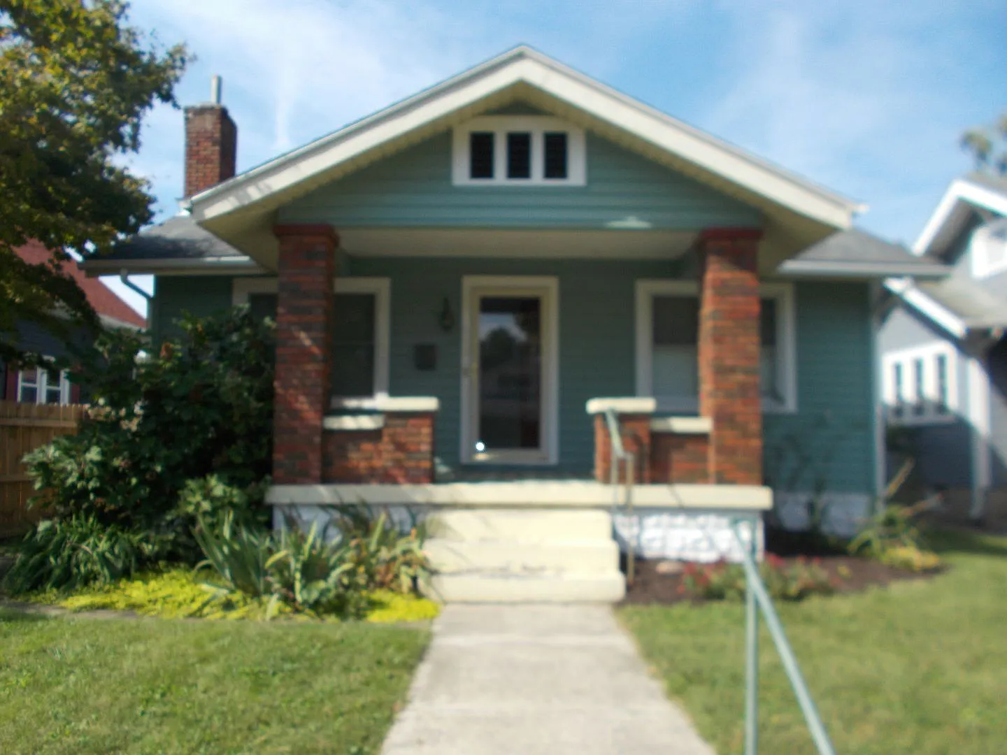 Charming 2-Bedroom Bungalow with Detached Garage & Beautifully Landscaped Yard! — Photo 1