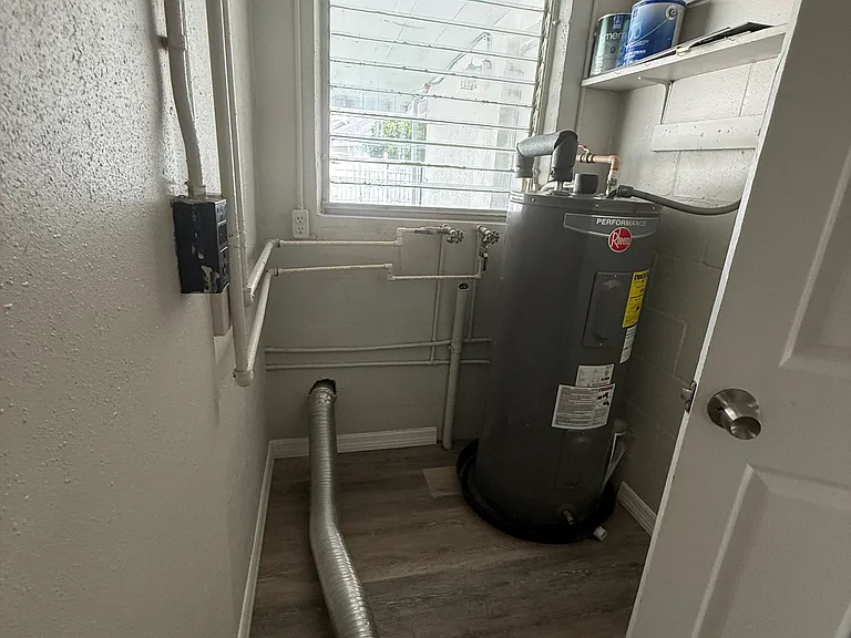Area for the stackable washer/dryer and hot water heater