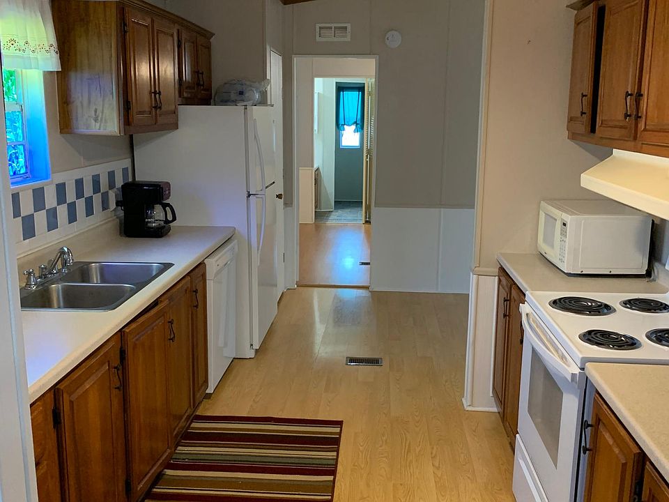 Galley Kitchen, small Dining Room on Right
Stove, Refrigerator and dishwasher stay