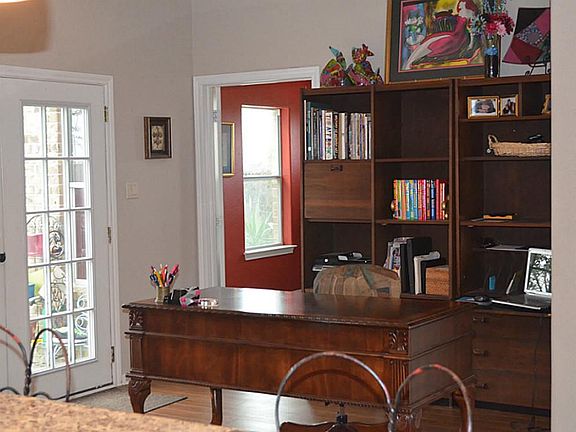 The bright breakfast area is naturally light and airy and has access to two French doors that open t