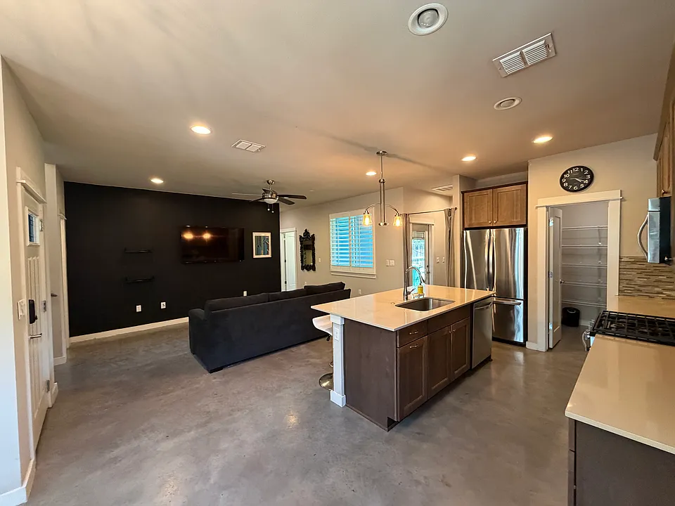 Large open concept main living area with dedicated open dining space.