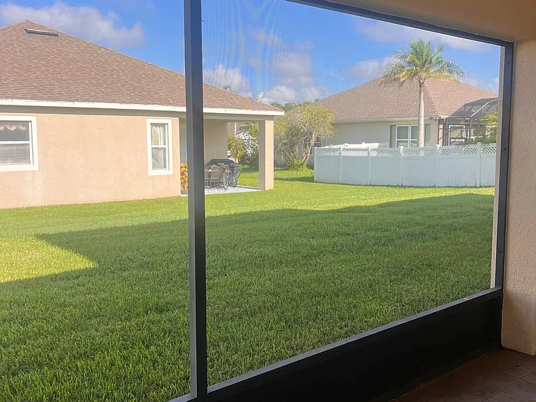 18 - Screened patio enclosure, ideal for outdoor dining and relaxing.
