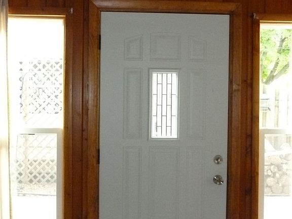 Updated entry door leads into..