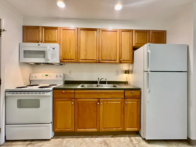 Beautiful kitchen with skylight for lots of natural light! New microwave. Double sink.